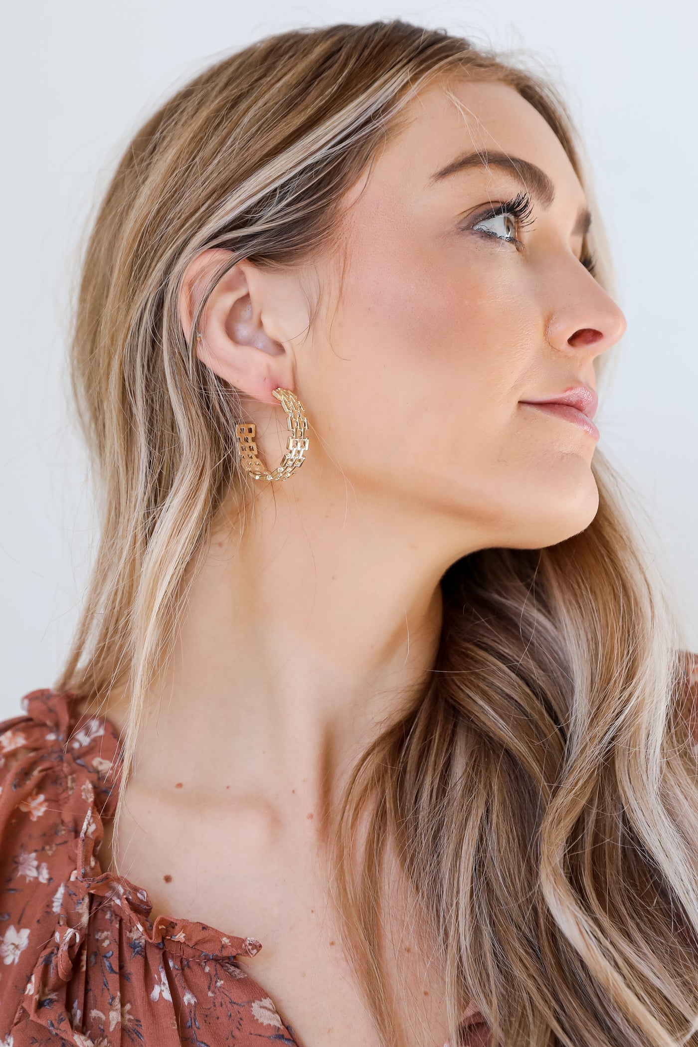 Gold Woven Hoop Earrings on model