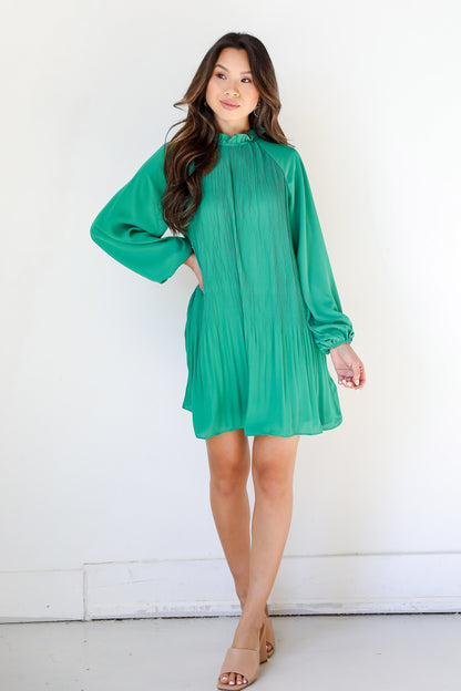 green Pleated Mini Dress on model