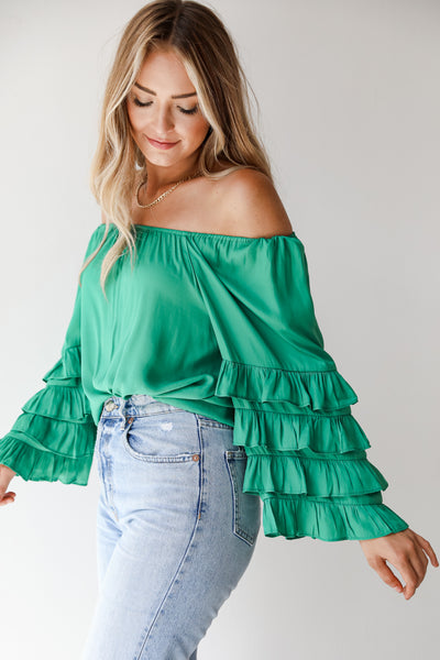 green ruffle sleeve blouse side view
