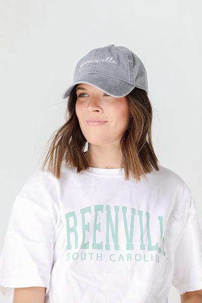 Greenville Script Embroidered Hat in grey on model