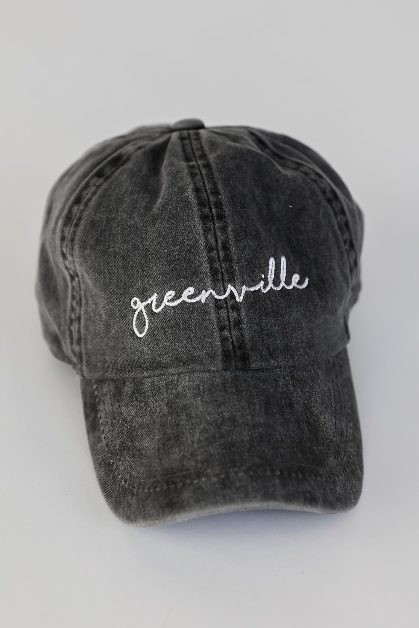 Greenville Script Embroidered Hat in black flat lay