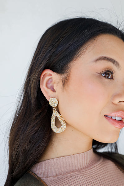 Gold Textured Drop Earrings on model