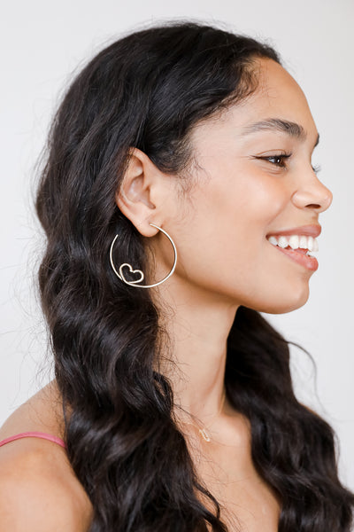 Gold Heart Hoop Earrings on model