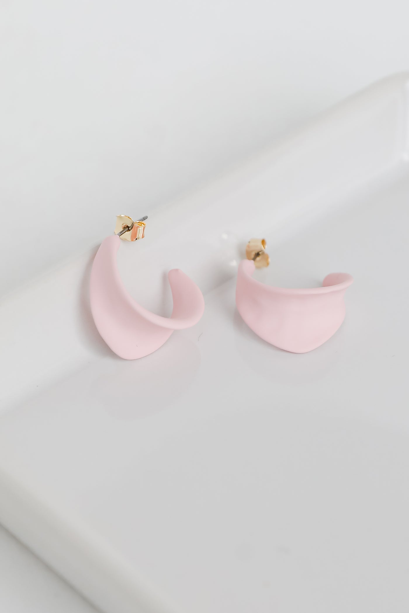 Matte Hoop Earrings in blush flat lay