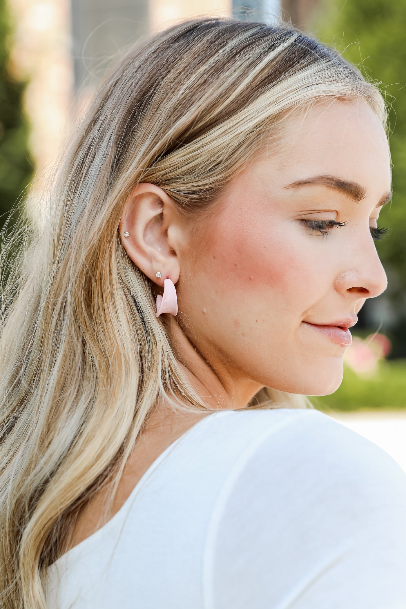 Matte Hoop Earrings in blush on model
