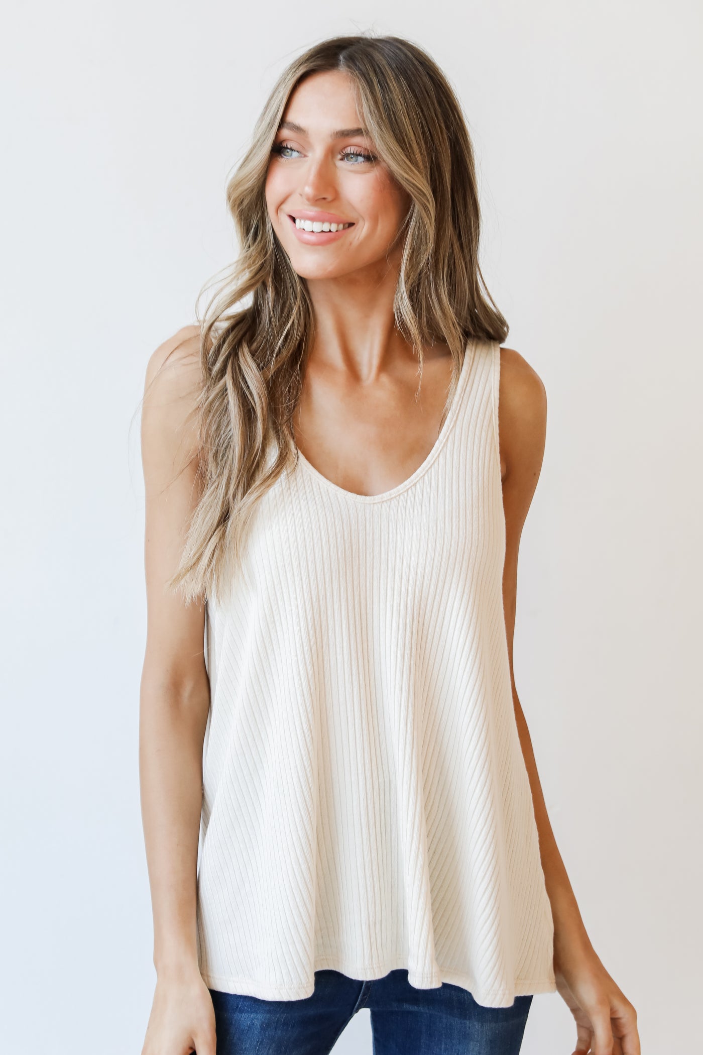 model wearing an ivory Ribbed Tank