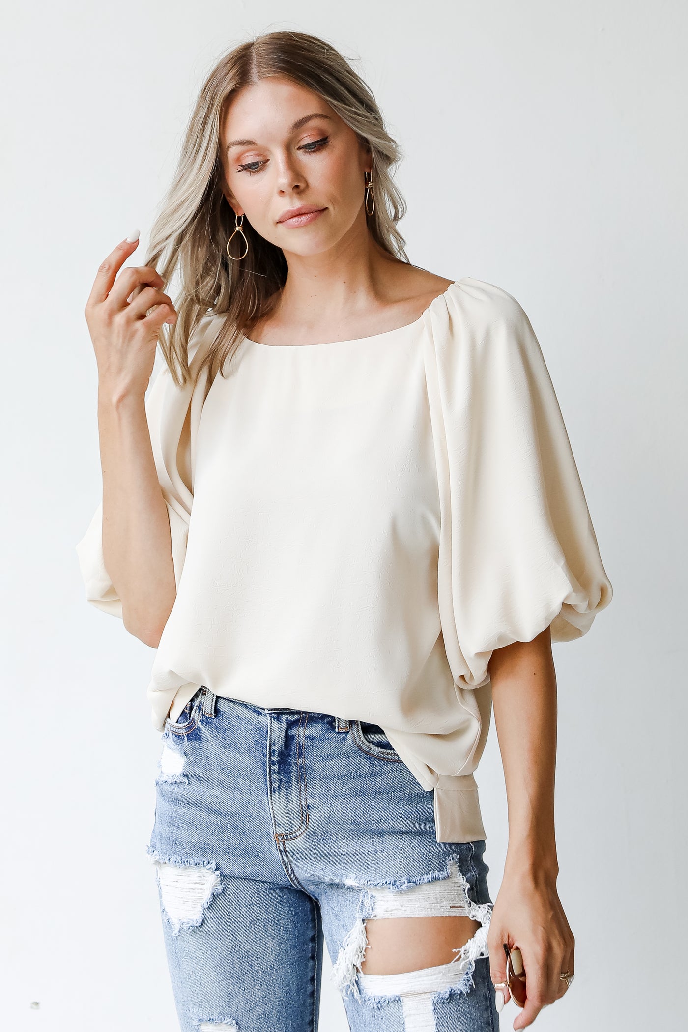front view of an ivory blouse