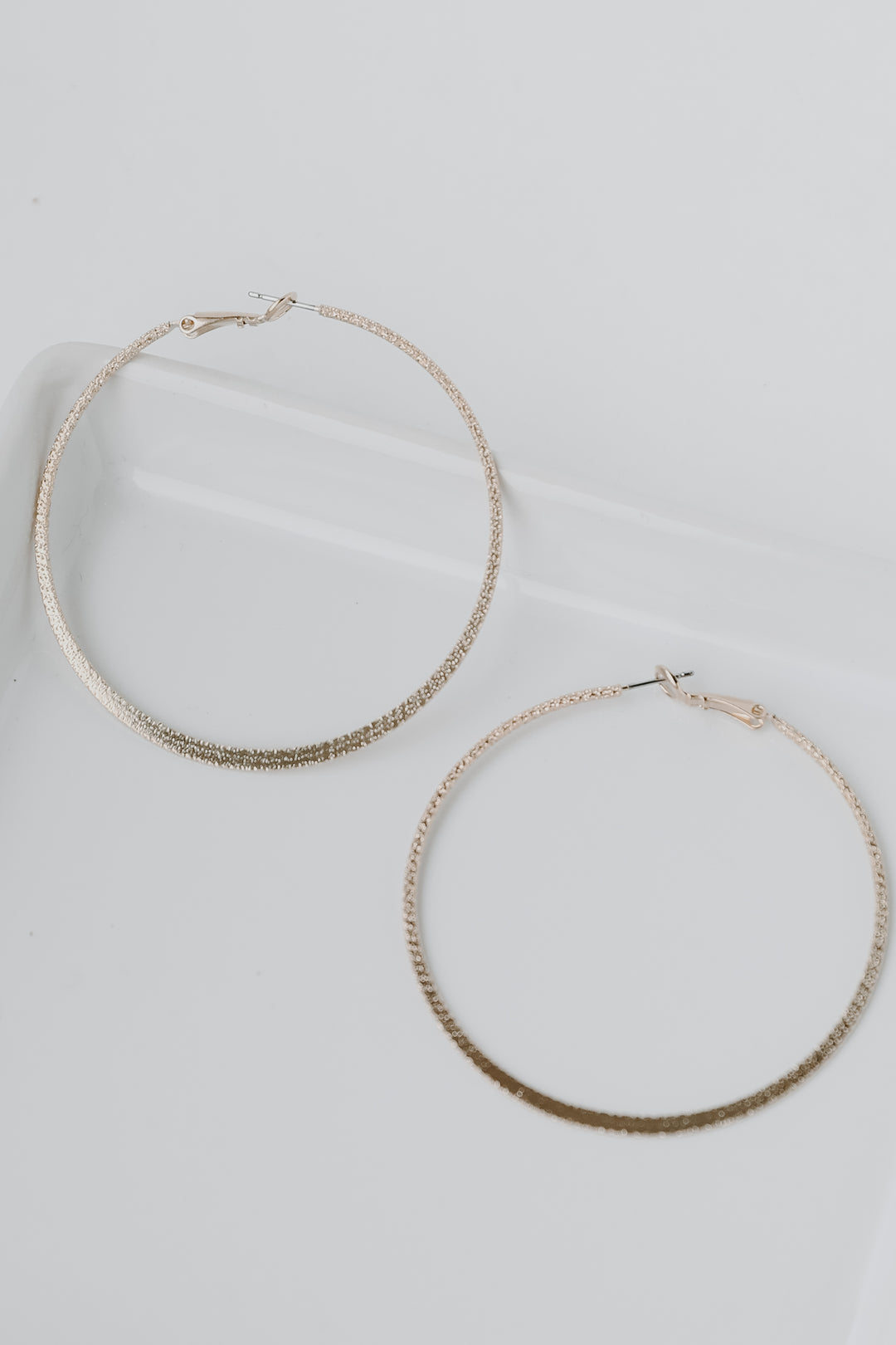 Gold Textured Hoop Earrings flat lay