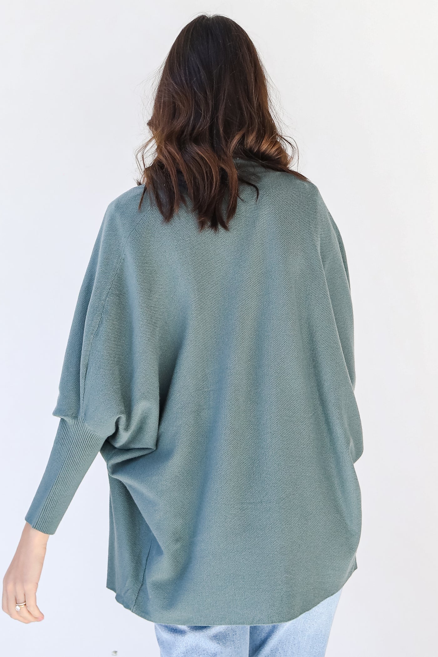 Cardigan in green back view