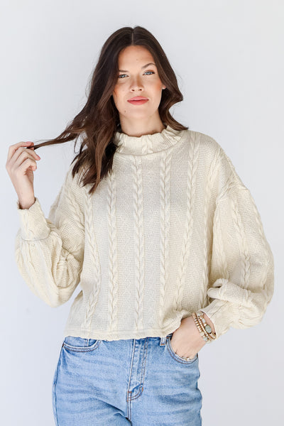 Cable Knit Top in ivory on model
