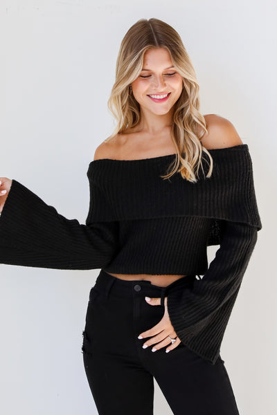 black Off-The-Shoulder Sweater on model