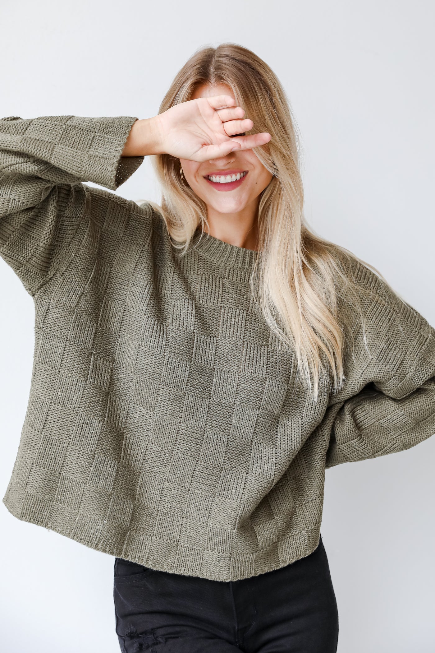 green checkered sweater on model