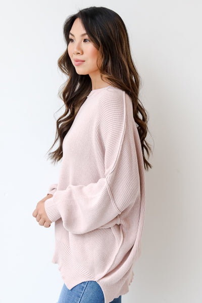 pink sweater side view