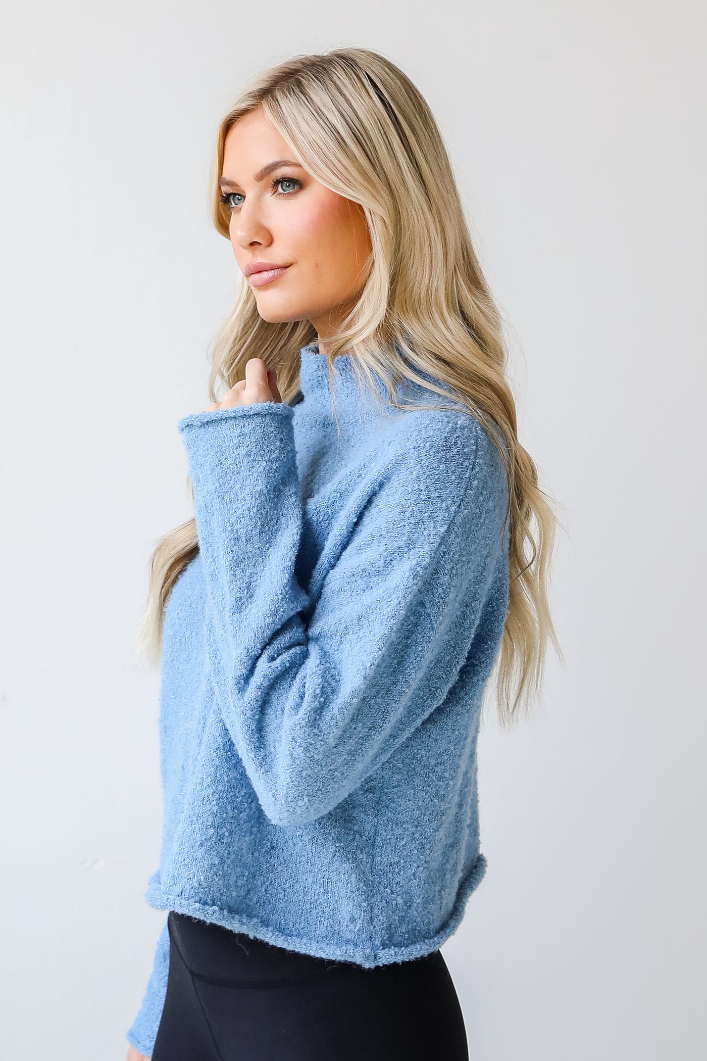 Sweater in blue side view