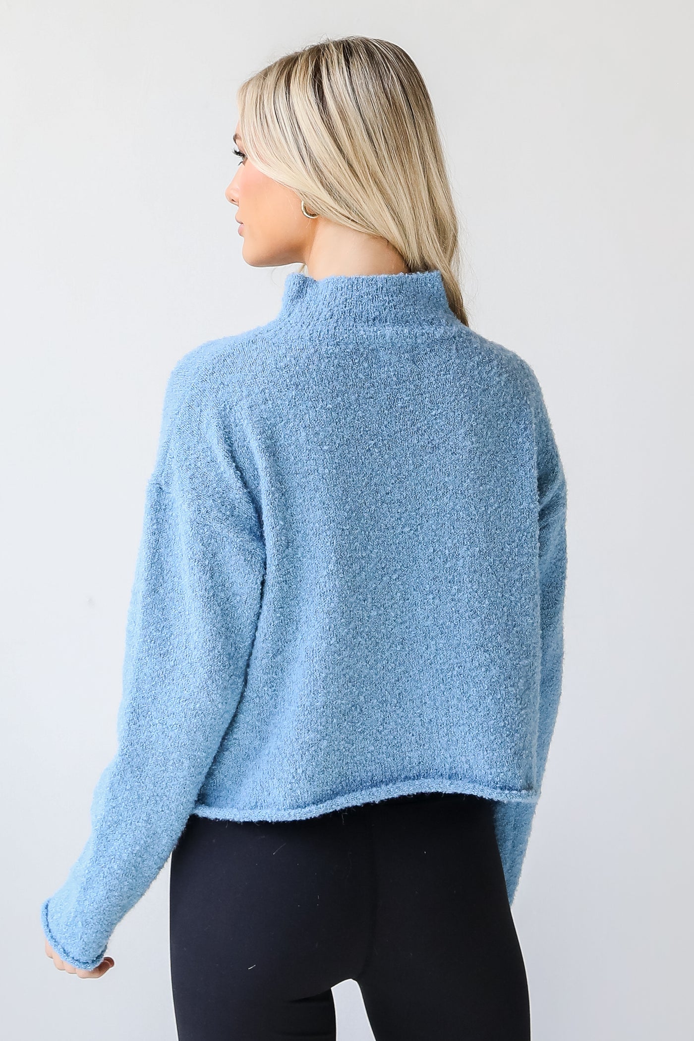 Sweater in blue back view