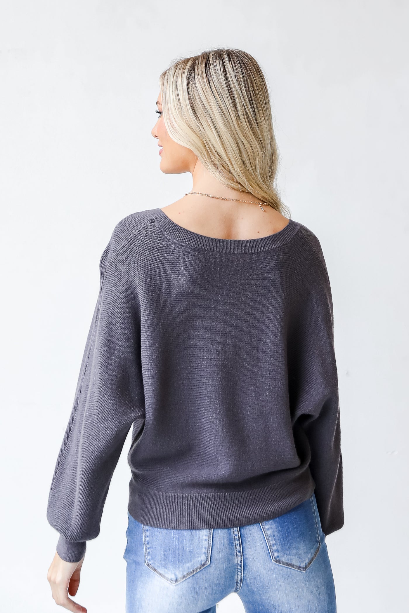 Sweater in grey back view