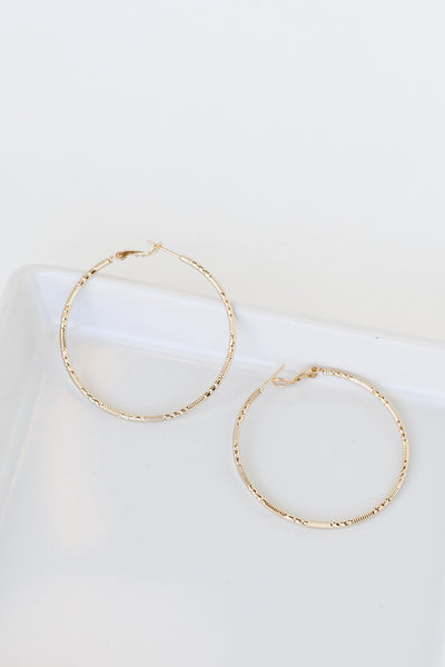 Gold Textured Large Hoop Earrings flat lay