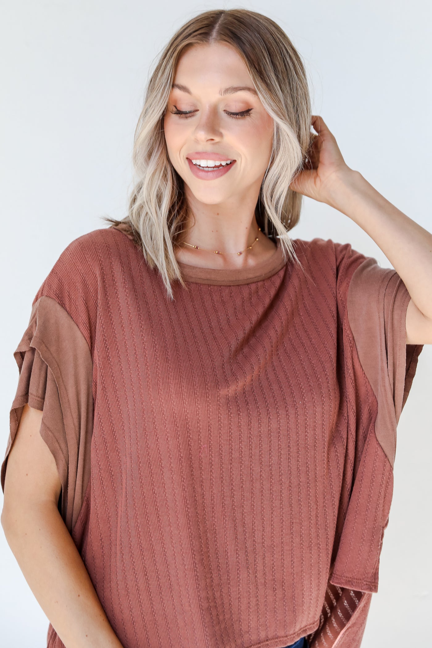 front view of a brown knit tee