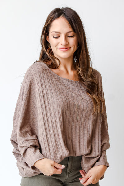 brown ribbed knit top on model