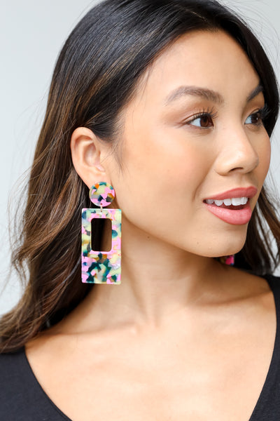 acrylic earrings on model
