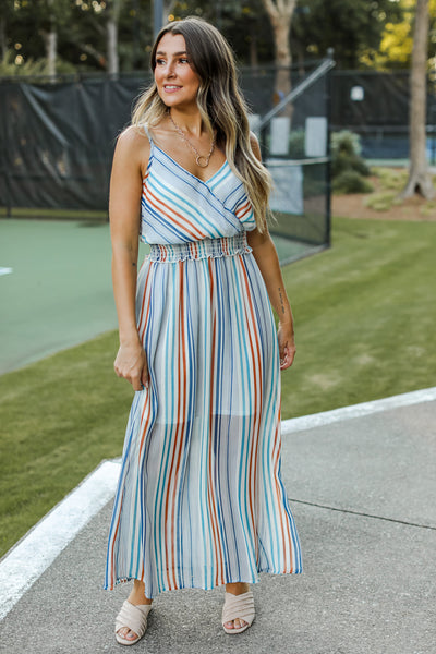front view of model wearing striped maxi dress