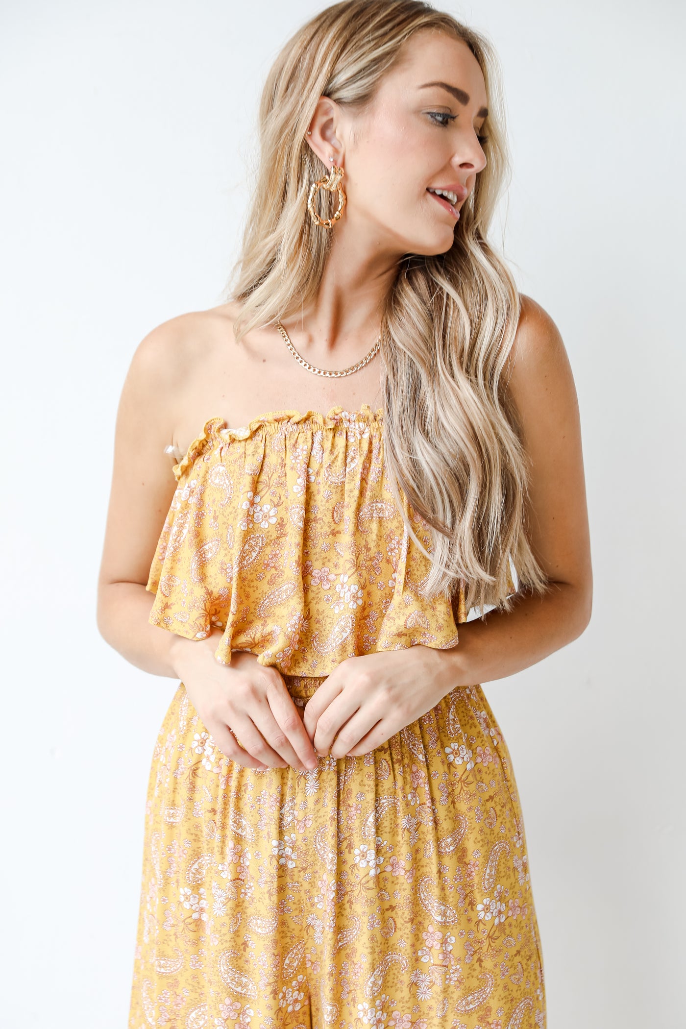 close up of a yellow floral jumpsuit