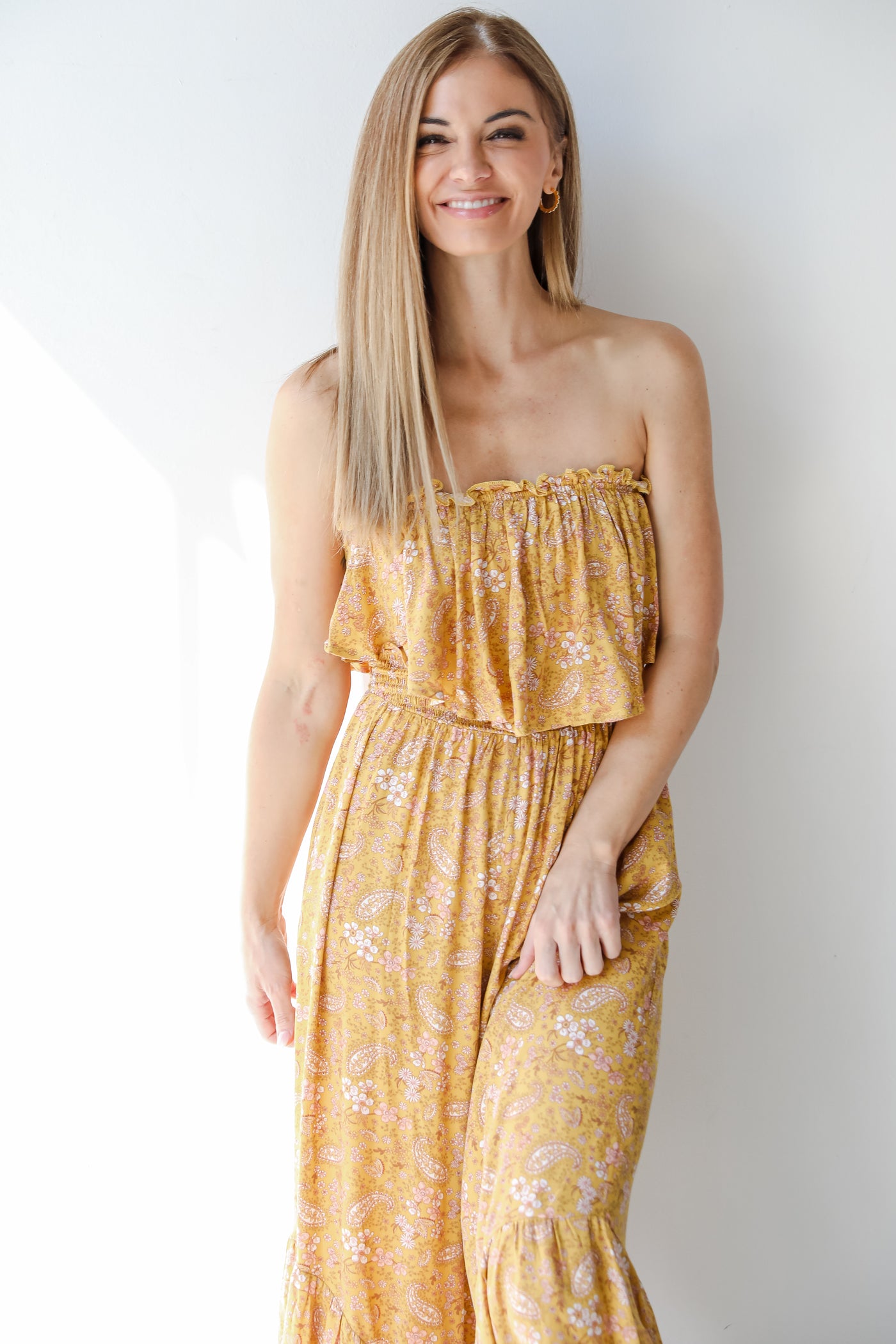 close up of a yellow floral jumpsuit