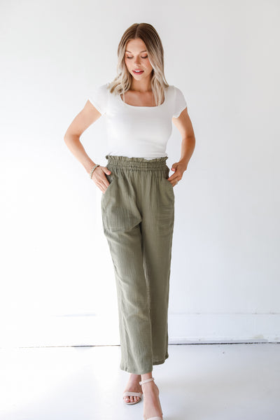 model wearing olive pants