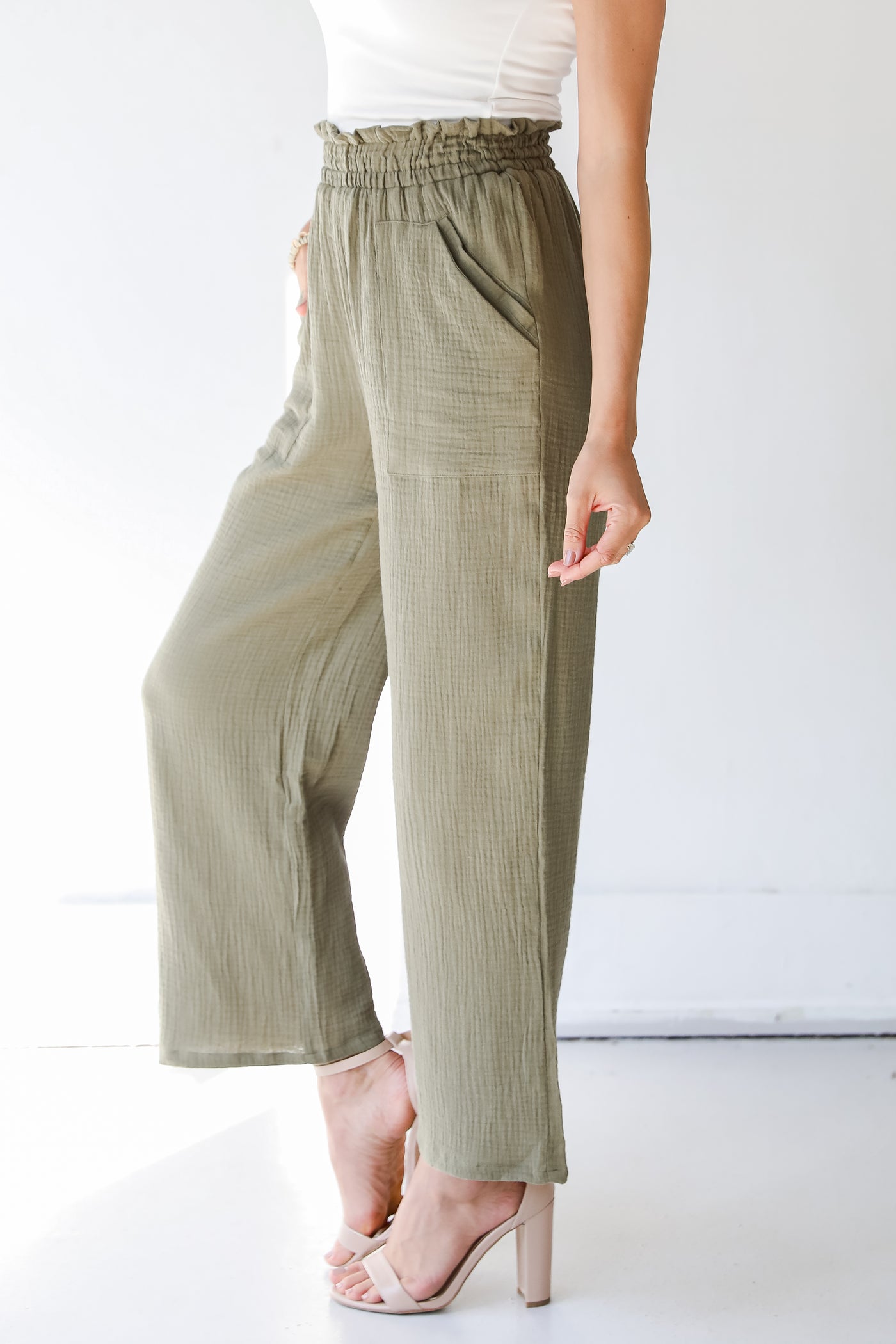 side view of olive green pants
