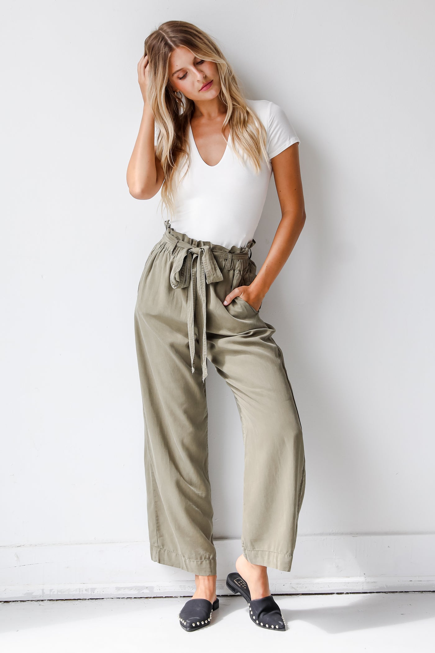 olive paperbag waist pants on model