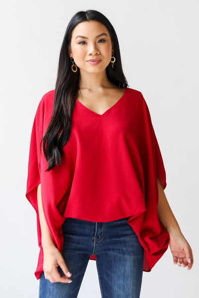 burgundy oversized blouse on model