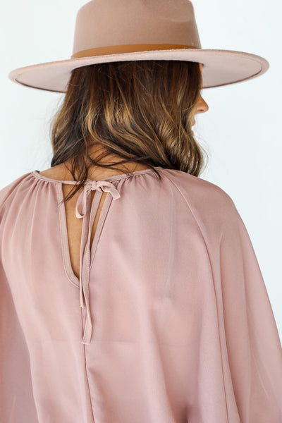 Blouse in tan back view
