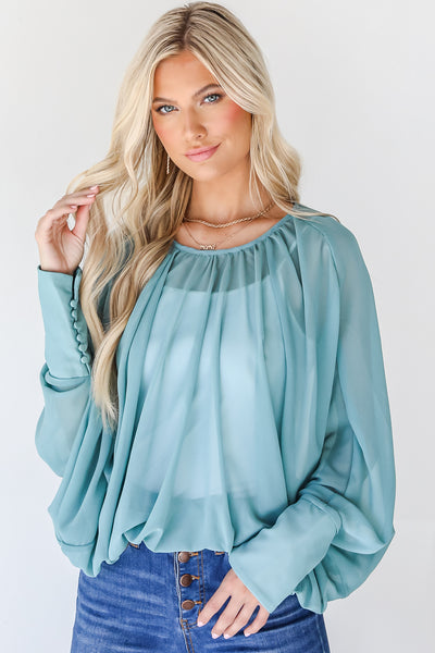 teal blouse