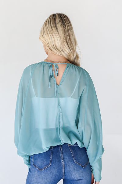 Blouse in teal back view