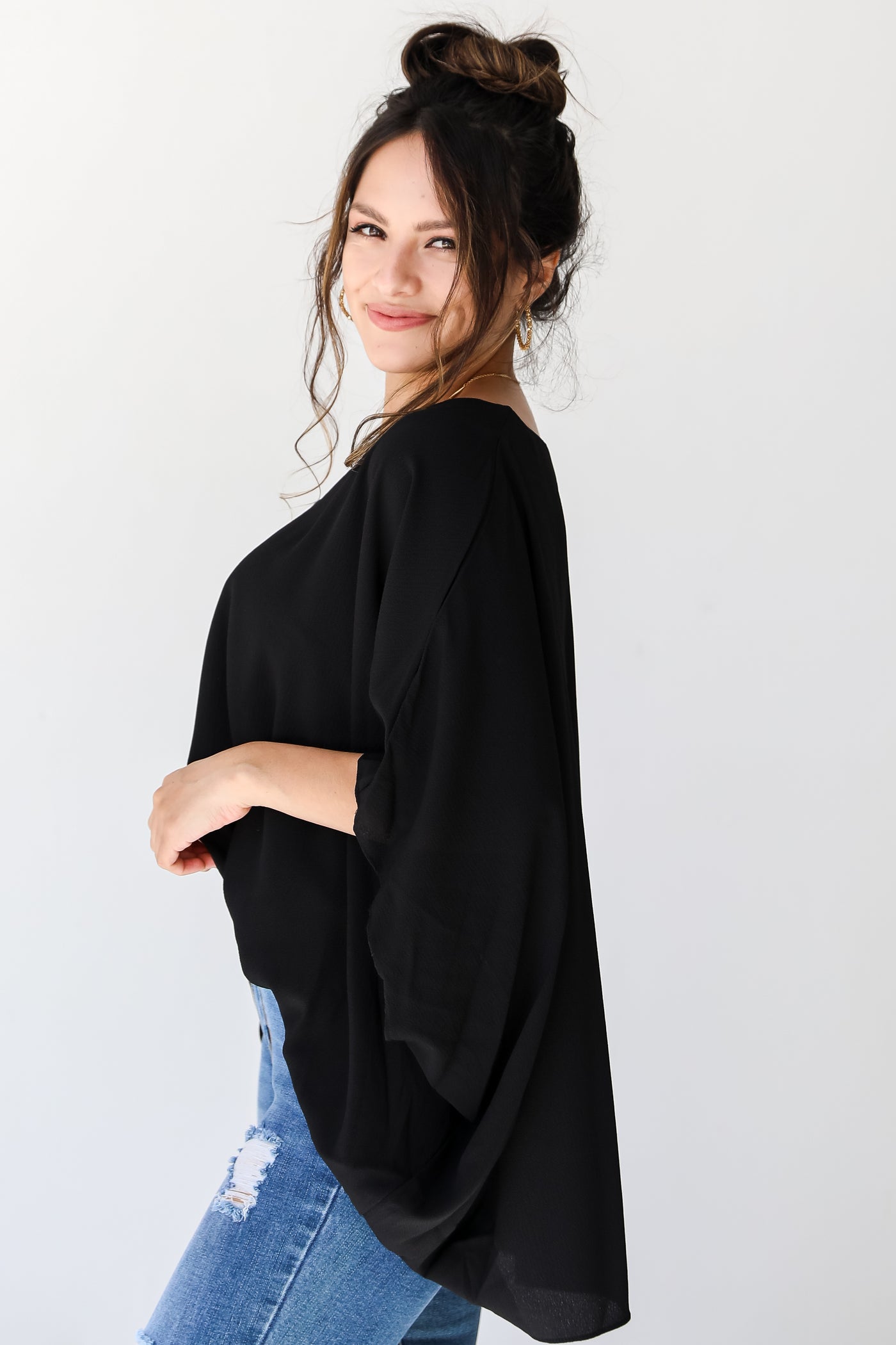 black oversized blouse side view