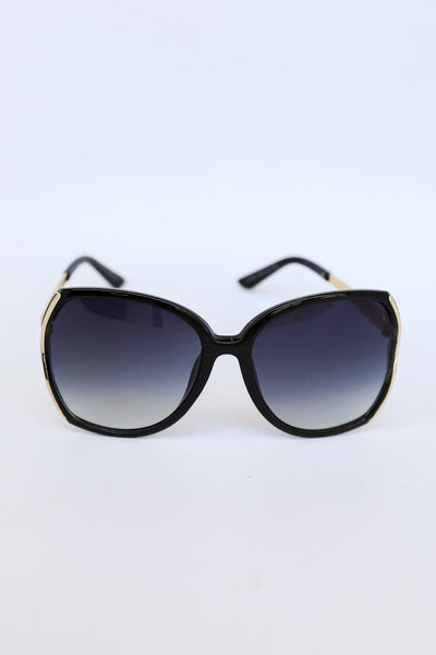 Oversized Sunglasses in black flat lay