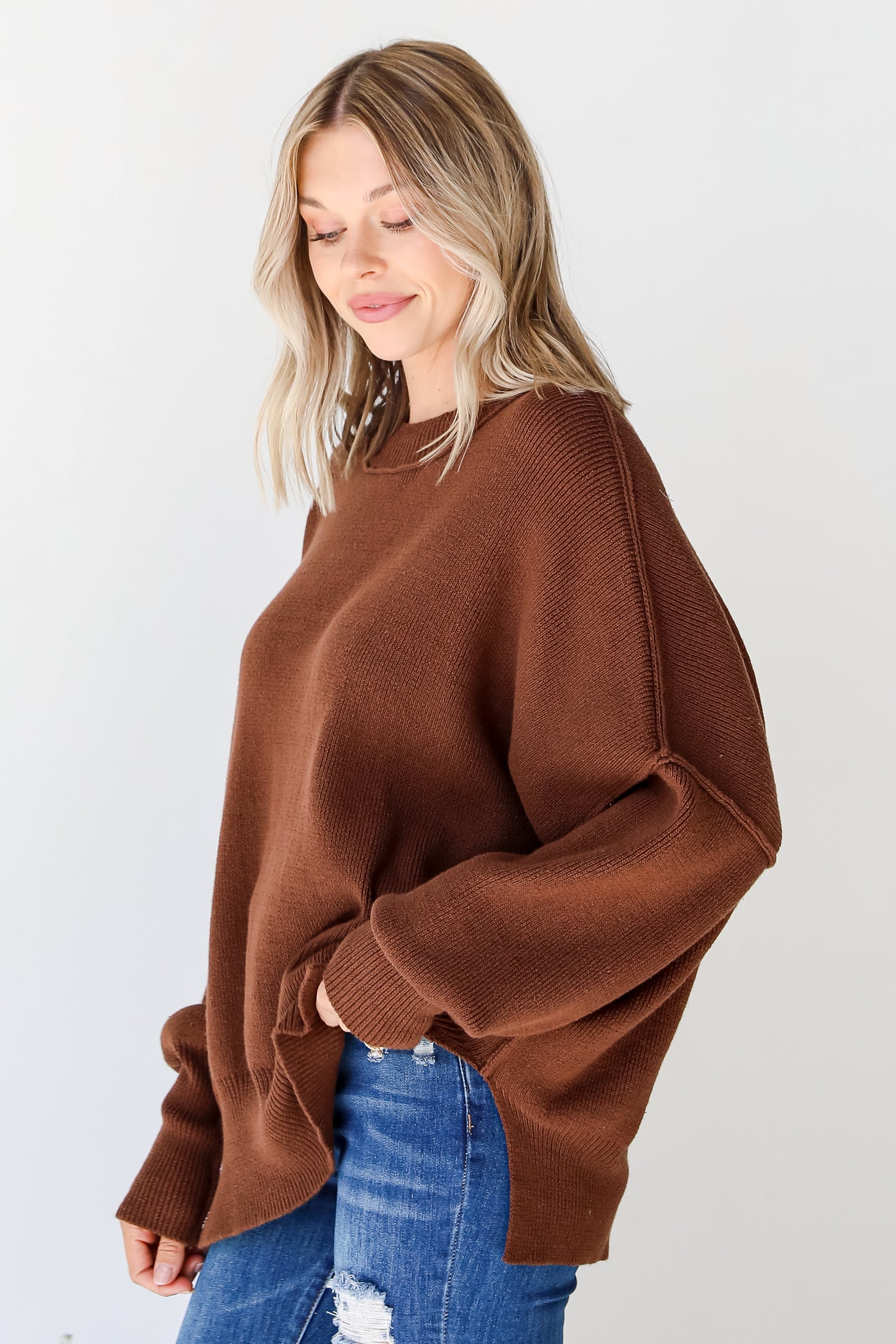 brown oversized sweater side view