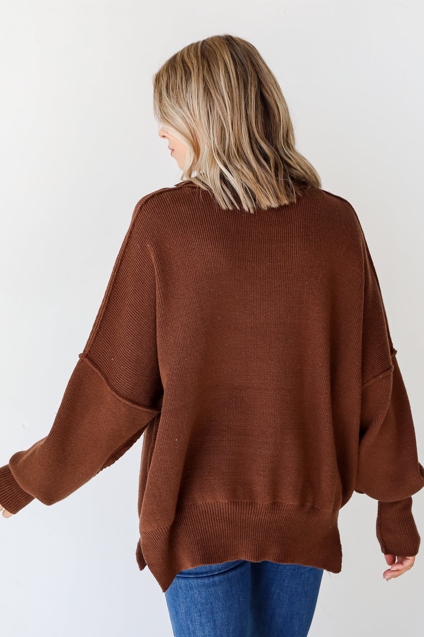 brown oversized sweater back view
