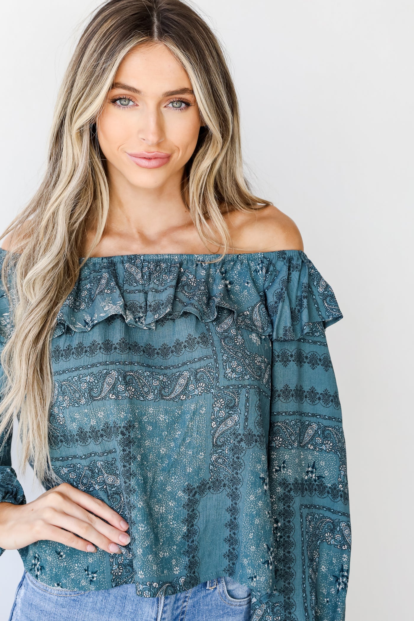 Floral Ruffle Blouse in teal on model