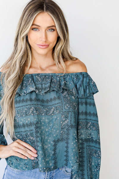Floral Ruffle Blouse in teal on model