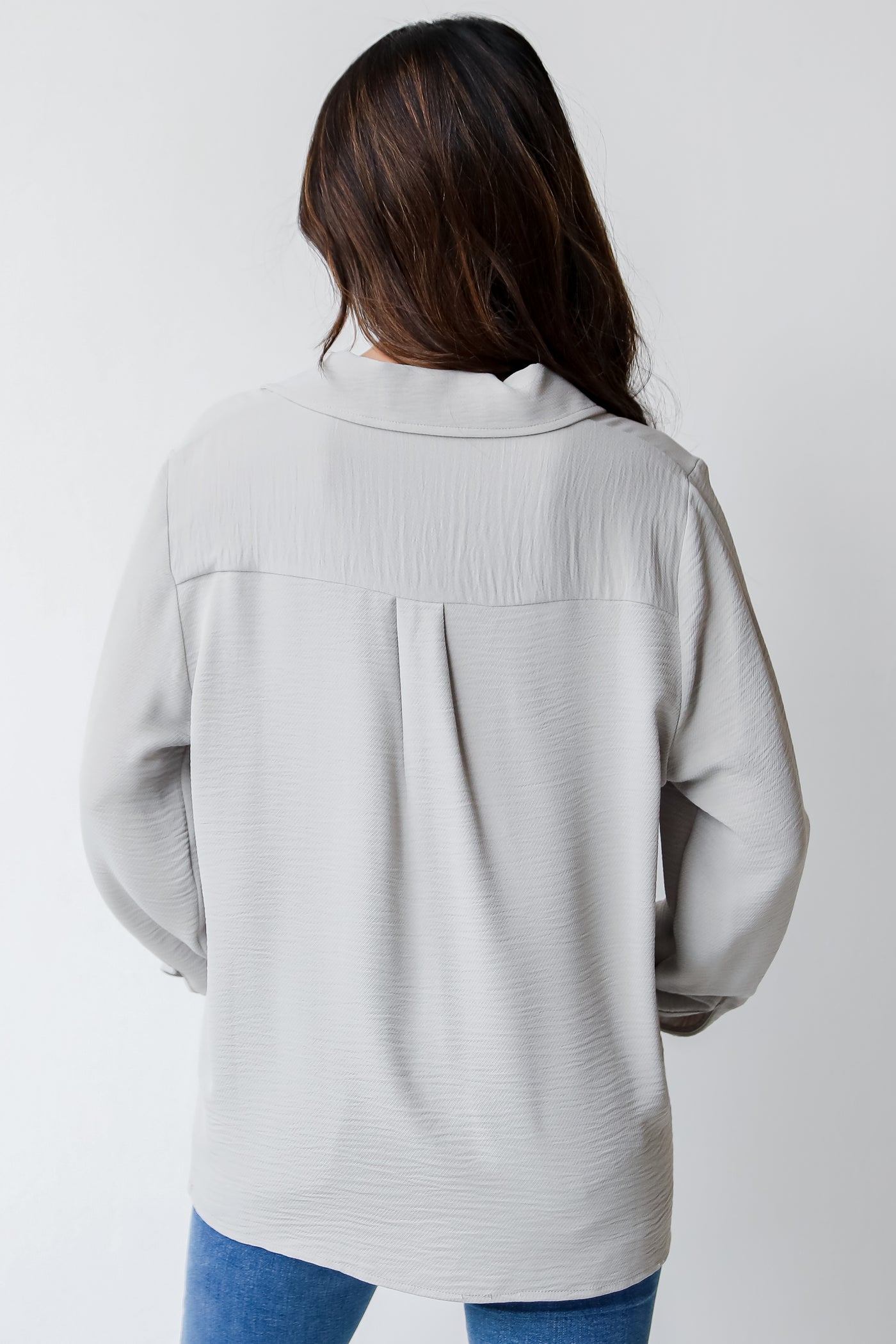 grey collared blouse back view