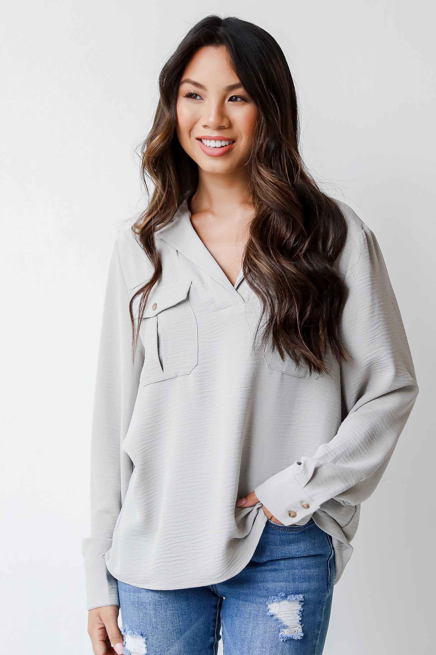 grey collared blouse on model