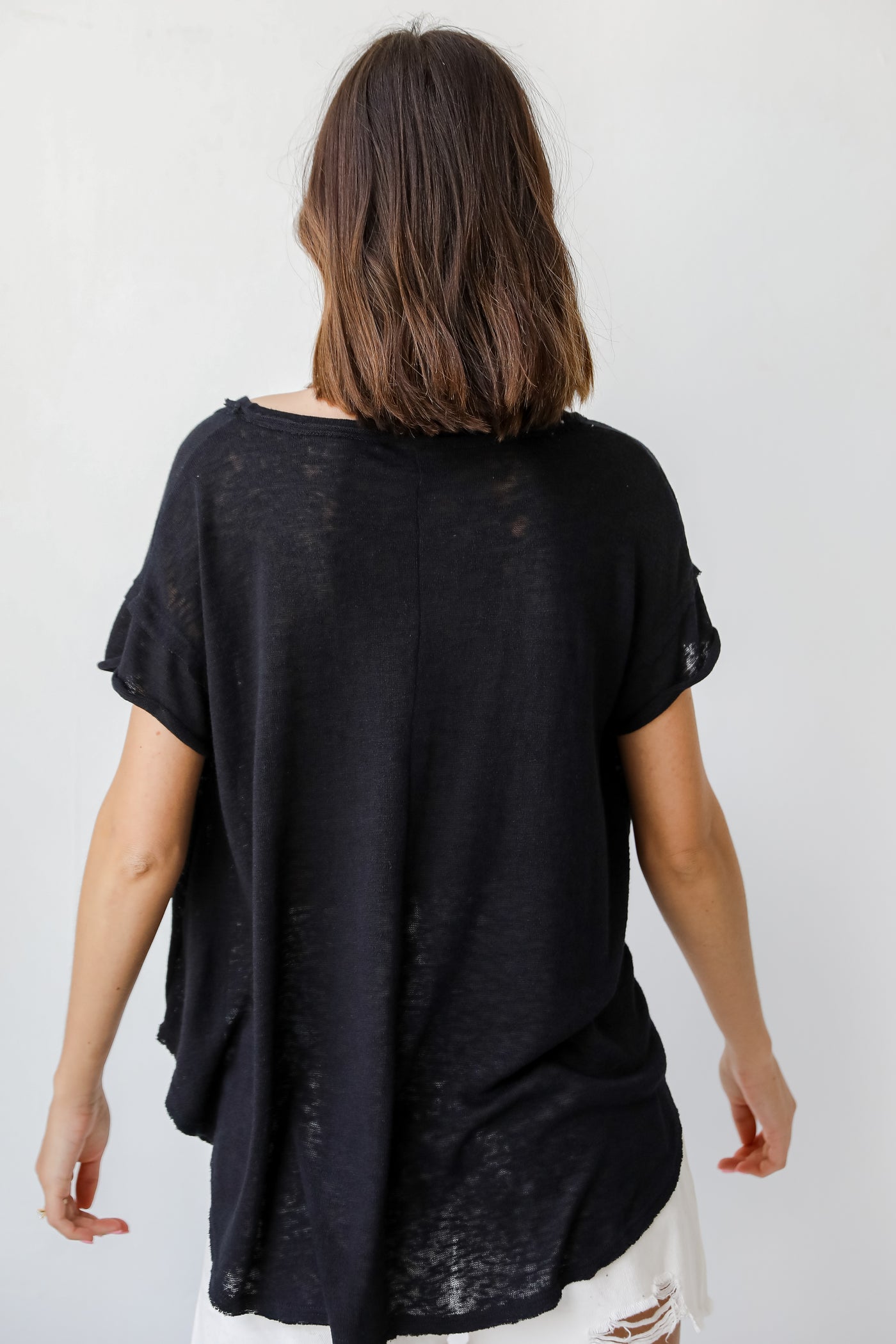 Knit Exposed Seam Tee in black back view