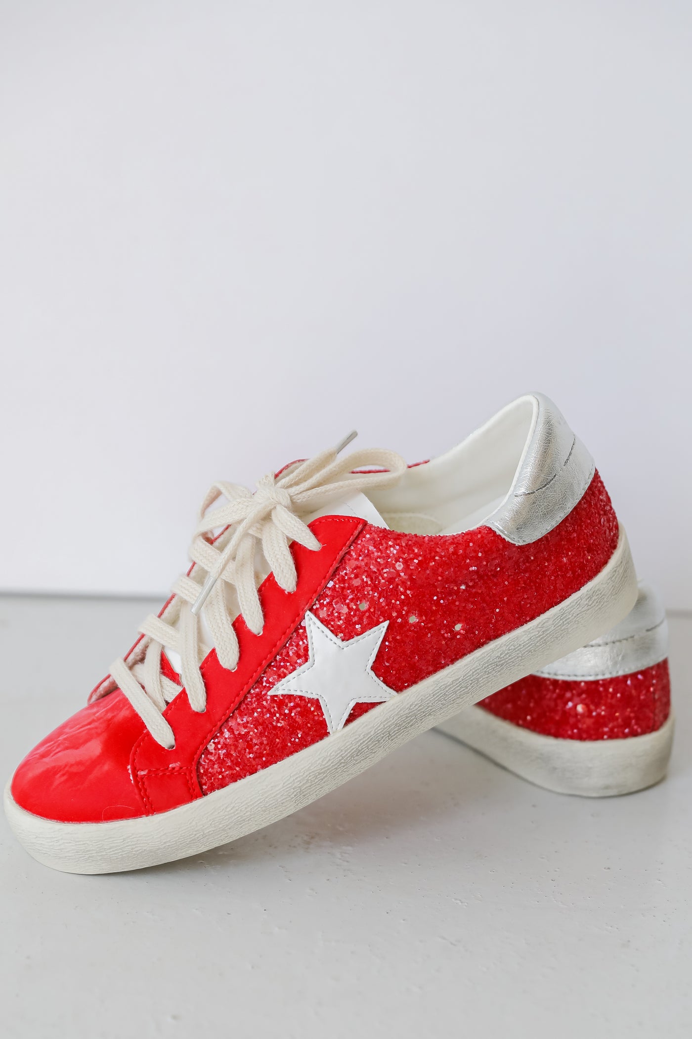 Red Glitter Star Sneakers flat lay