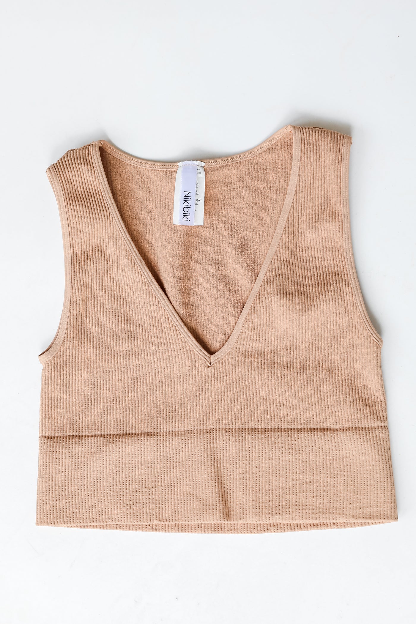 V-Neck Ribbed Cropped Tank in nude flat lay