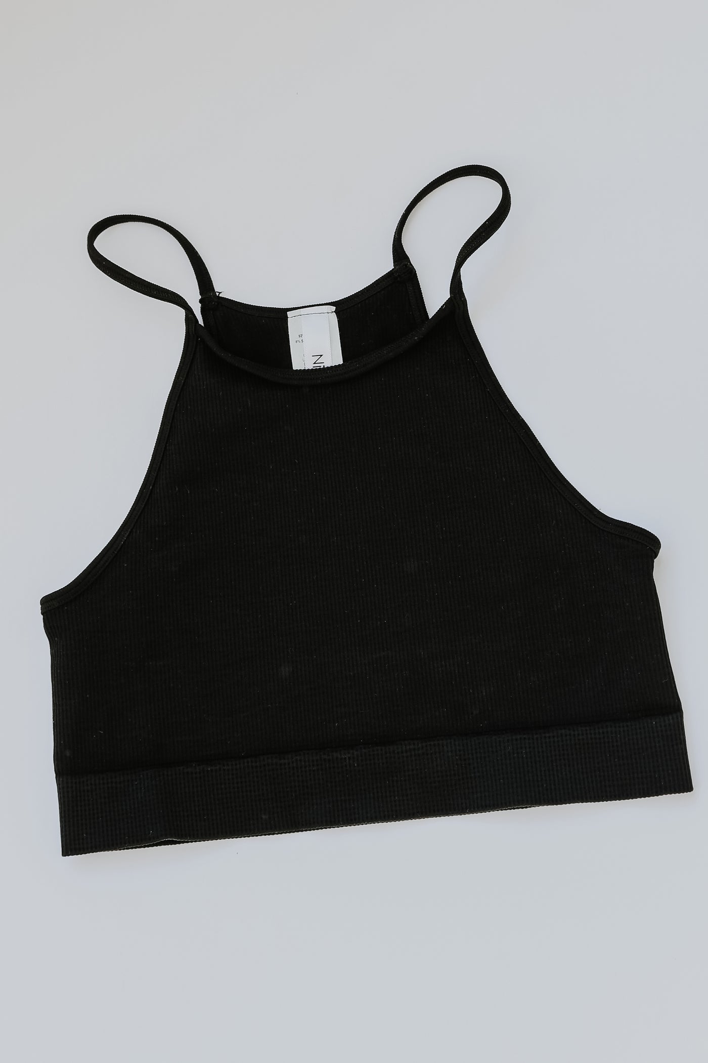 Seamless Cropped Ribbed Tank in black flat lay