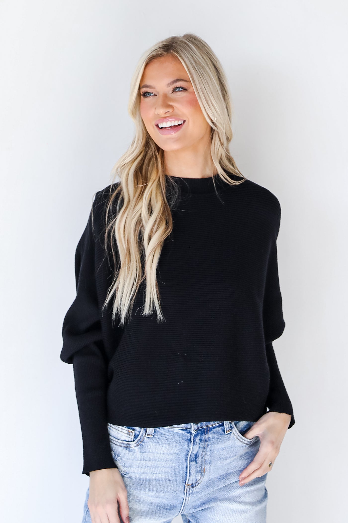 Ribbed Sweater in black on model