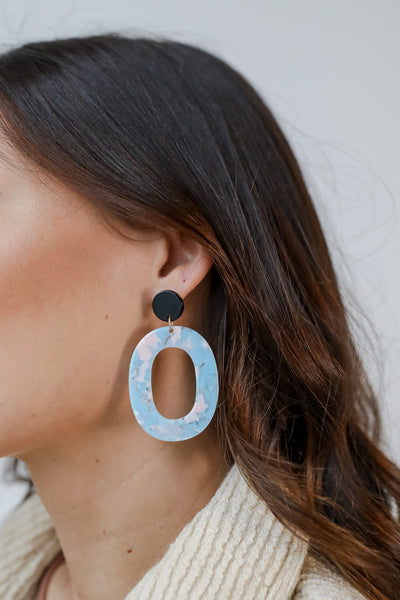 Acrylic Statement Earrings in light blue on model