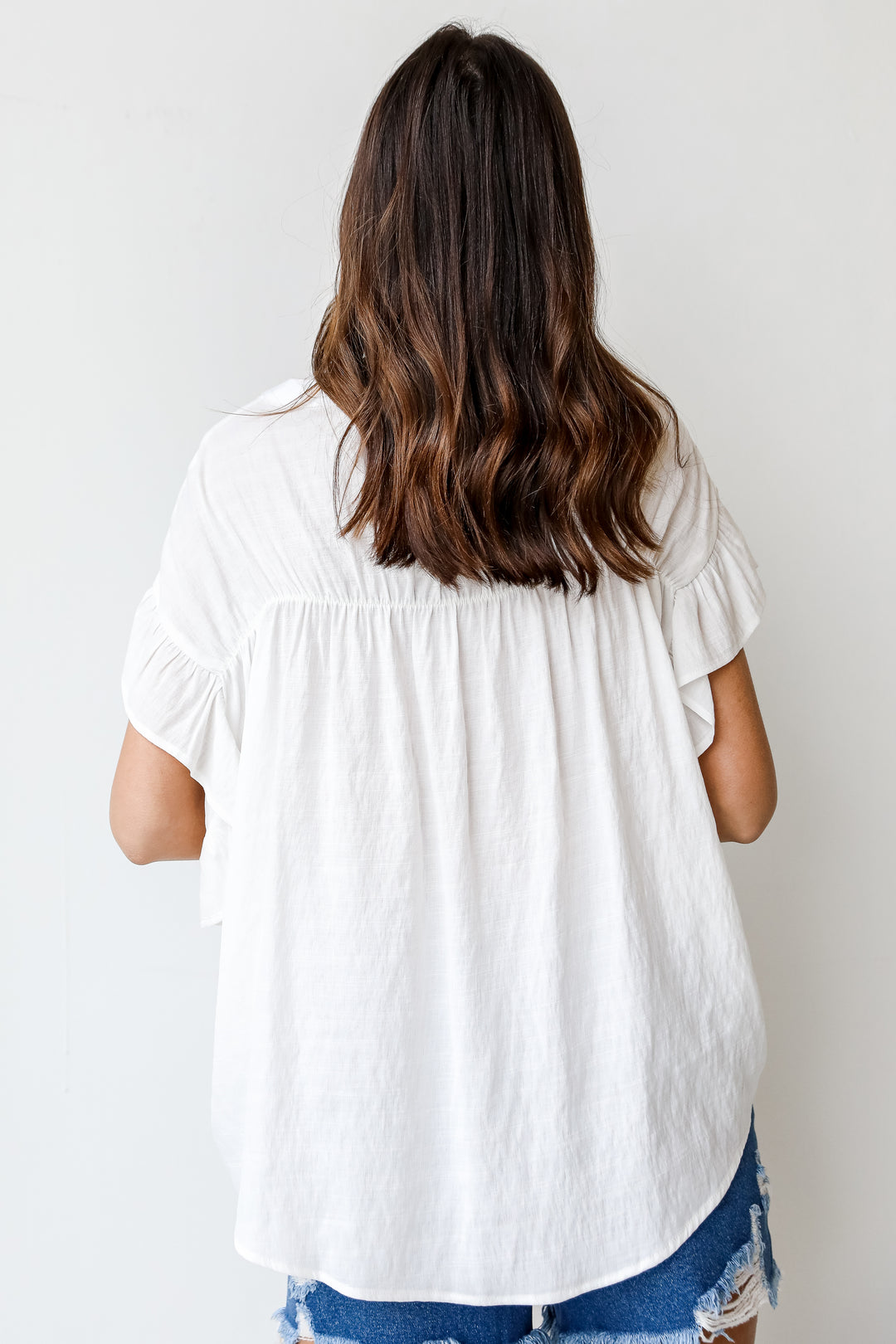 Ruffle Blouse in white back view