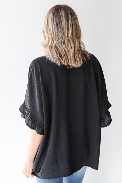 Ruffle Blouse in black back view